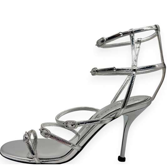 Alexander McQueen · luxury shoes · silver heels · stiletto · strappy sandals · designer footwear · prabangūs bateliai · second hand luxury · McQueen original · metallic sandals · Made in Italy · aukštakulniai · vestuviniai bateliai · vakariniai bateliai
Alexander McQueen silver sandals strappy heels stiletto sandals luxury shoes designer heels metallic sandals McQueen original box second hand luxury wedding heels evening sandals open toe heels buckle sandals Made in Italy